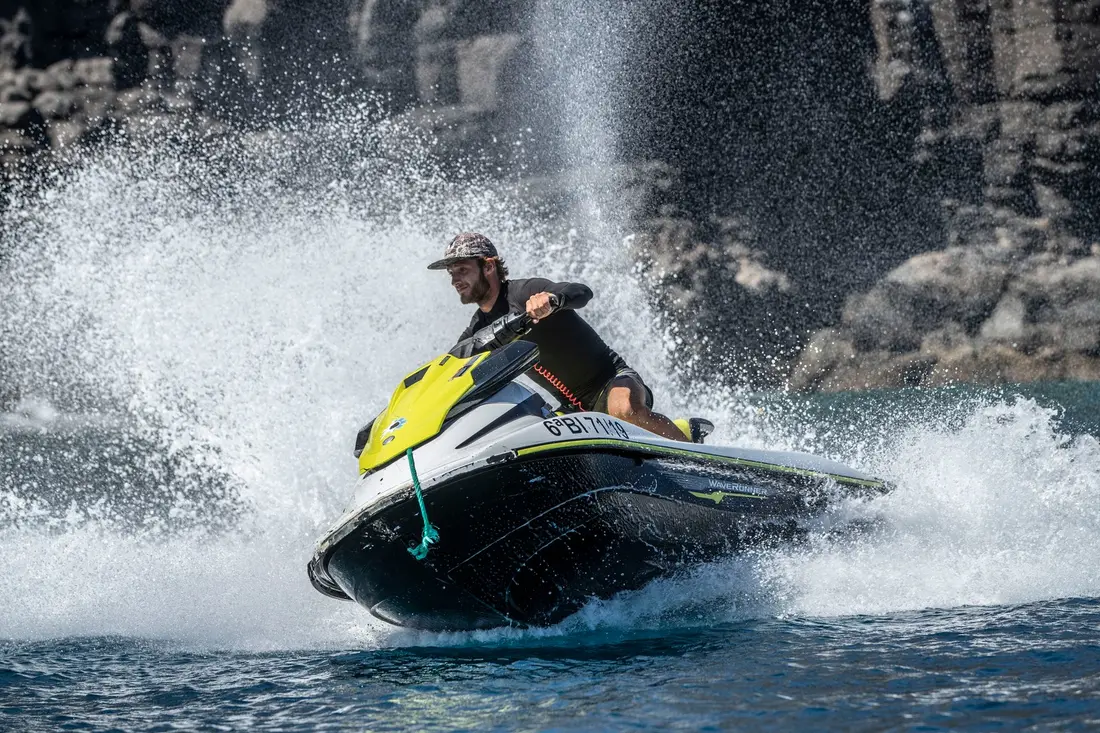Jet ski riding along the volcanic coast near Puerto del Carmen